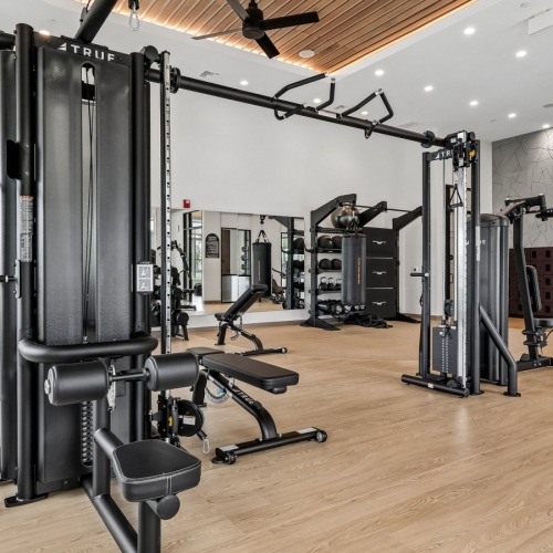 a spacious room with strength training equipment