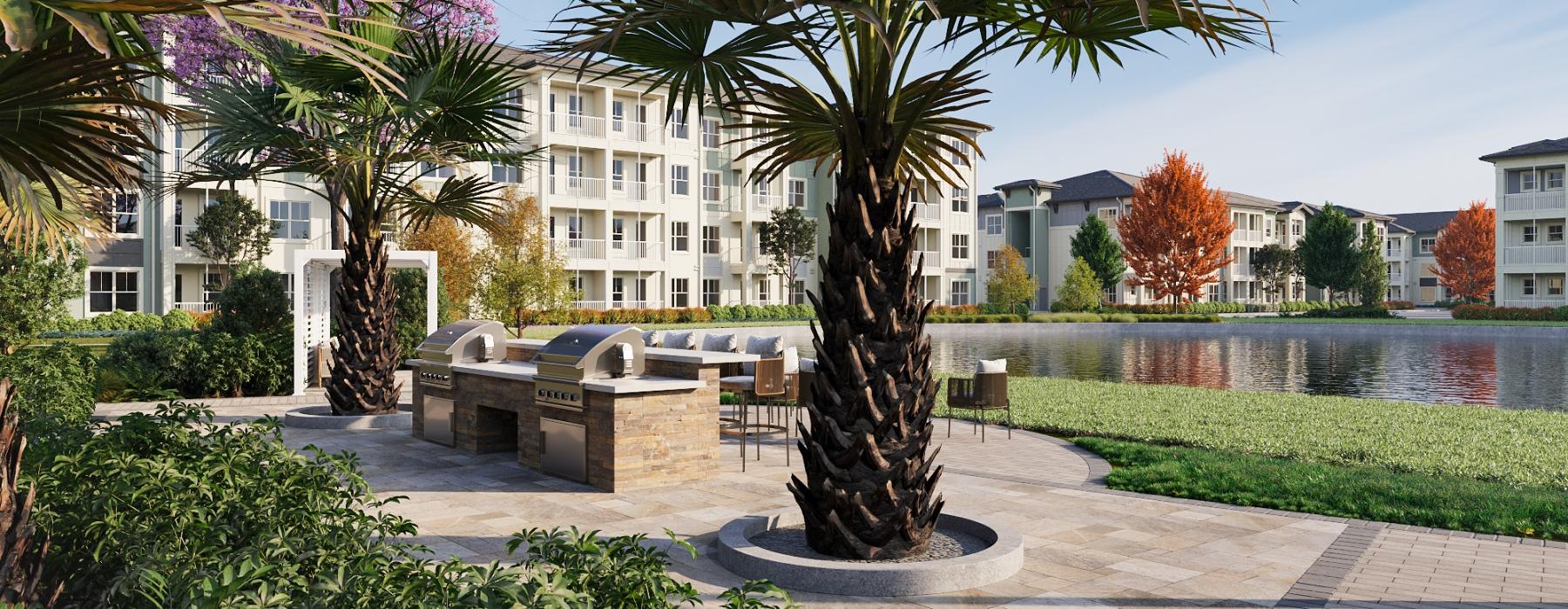 a courtyard near a pond with a large grilling area and palm trees