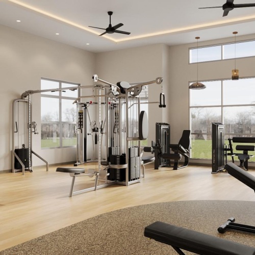 a spacious room with strength training equipment